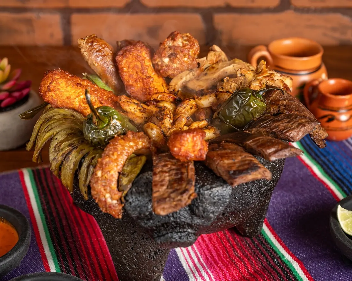 Molcajete Mar y Tierra: shrimp, steak, cactus and roasted chiles served bubbling in a volcanic stone molcajete at Autentica Taqueria
